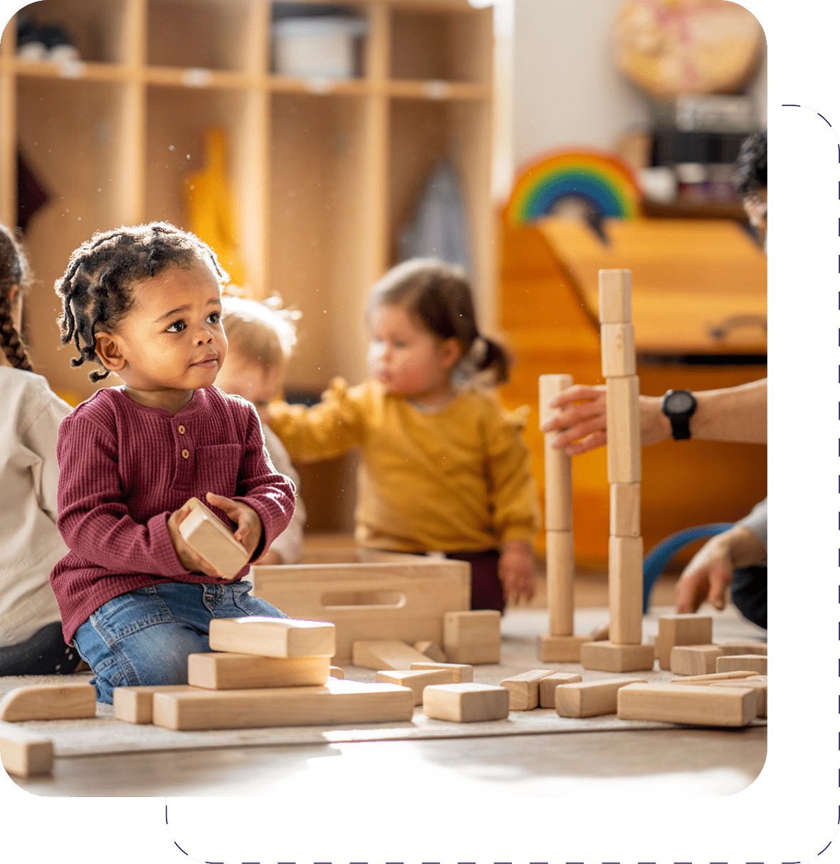 Toddlers engaged in block activities