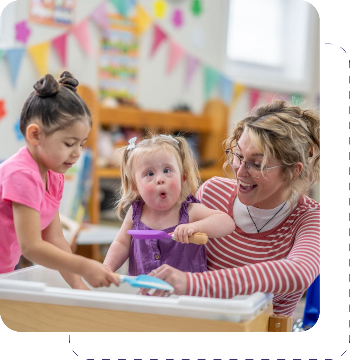 Happy classroom interaction with teacher and children